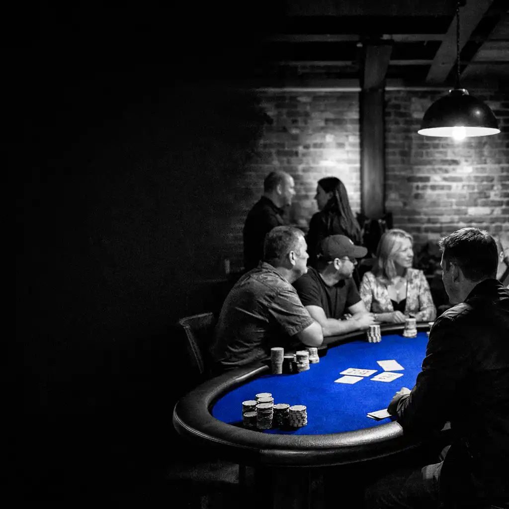Guests gathered around a cobalt felt poker table in ozplayy’s physical card room