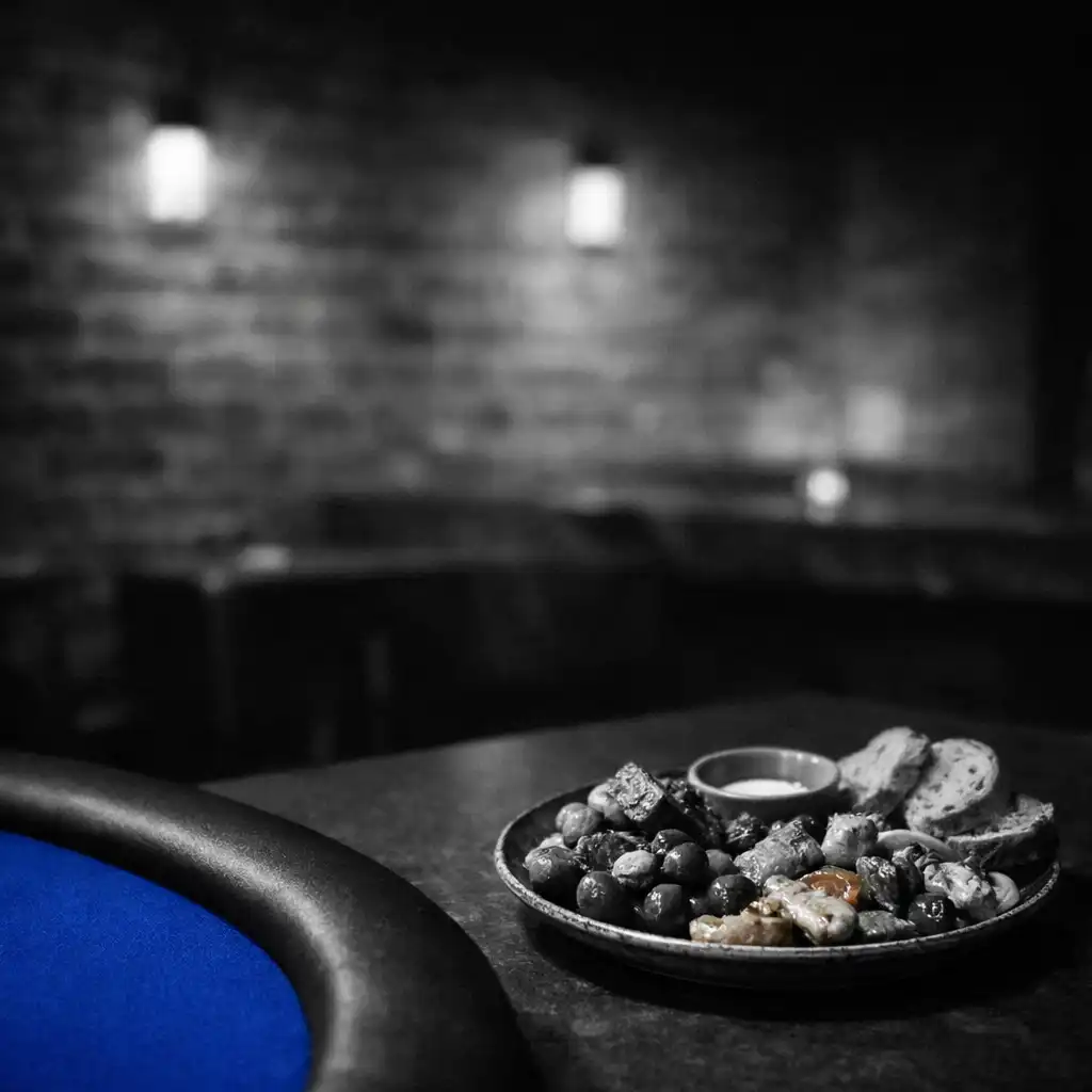 Shared plate beside a cobalt-felt table edge in the ozplayy venue